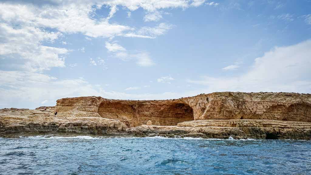 Gala Beach in Koufonisia. A giant cave carved into a seaside cliff.