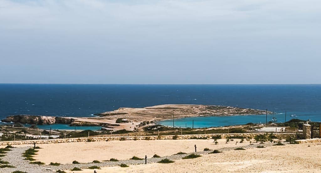 View of Pori Beach and Ksylompatis Caves from up on a hill.